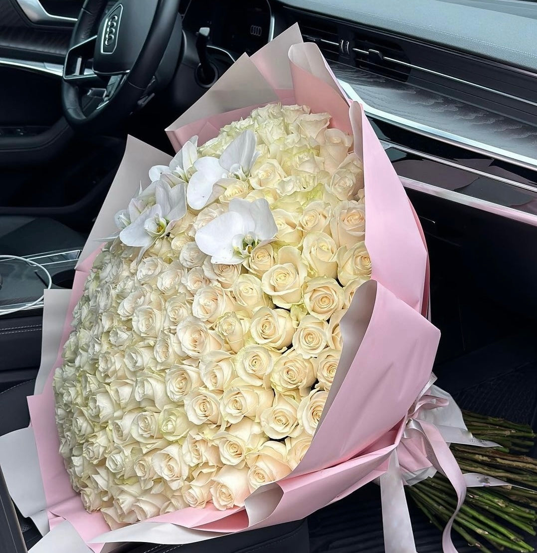 100 white roses wrapped in a bouquet