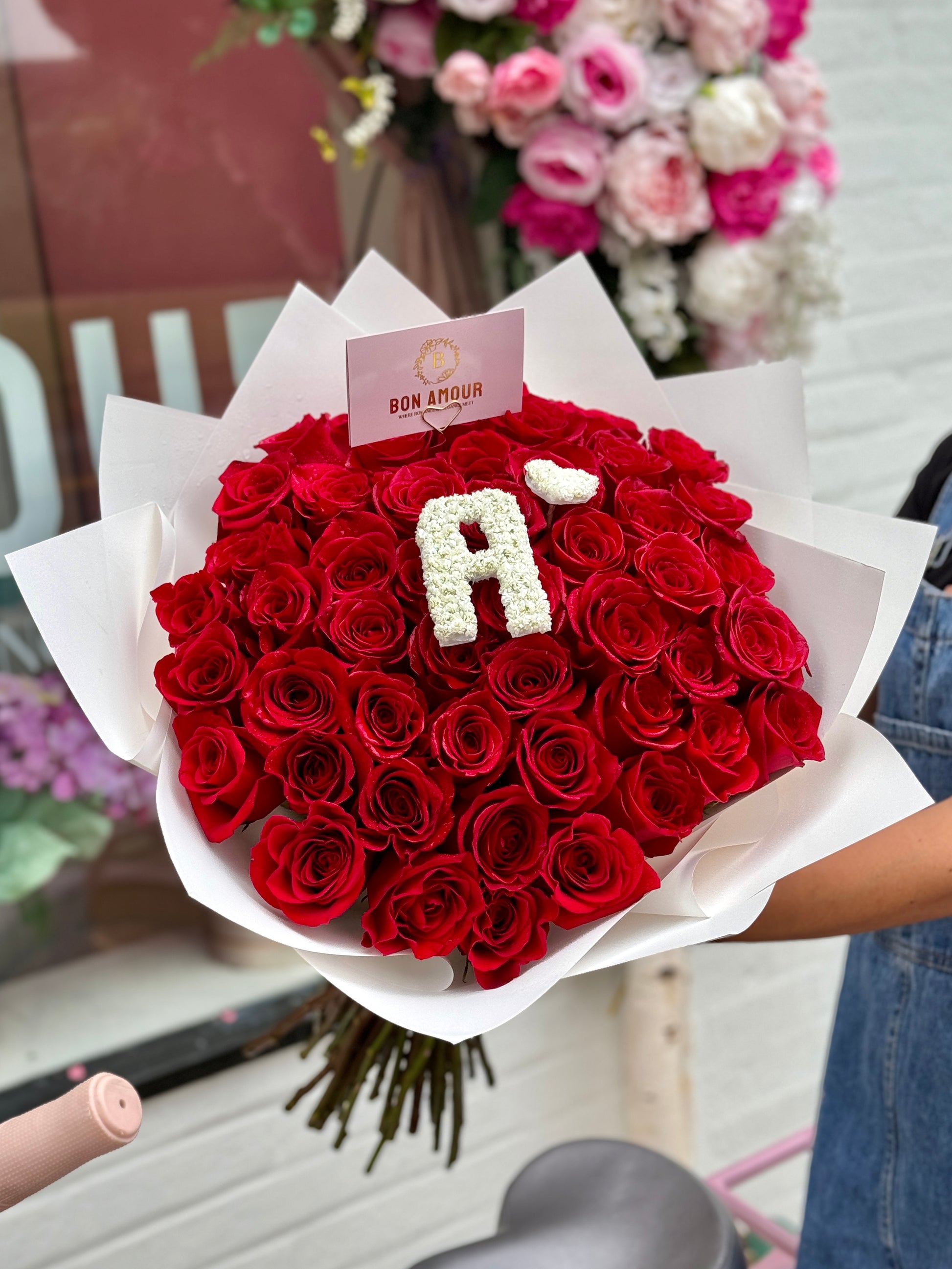 50 Red roses with a personalized initial A. wrapped in a bouquet