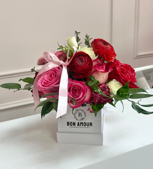 Flower box with mixed roses and flowers