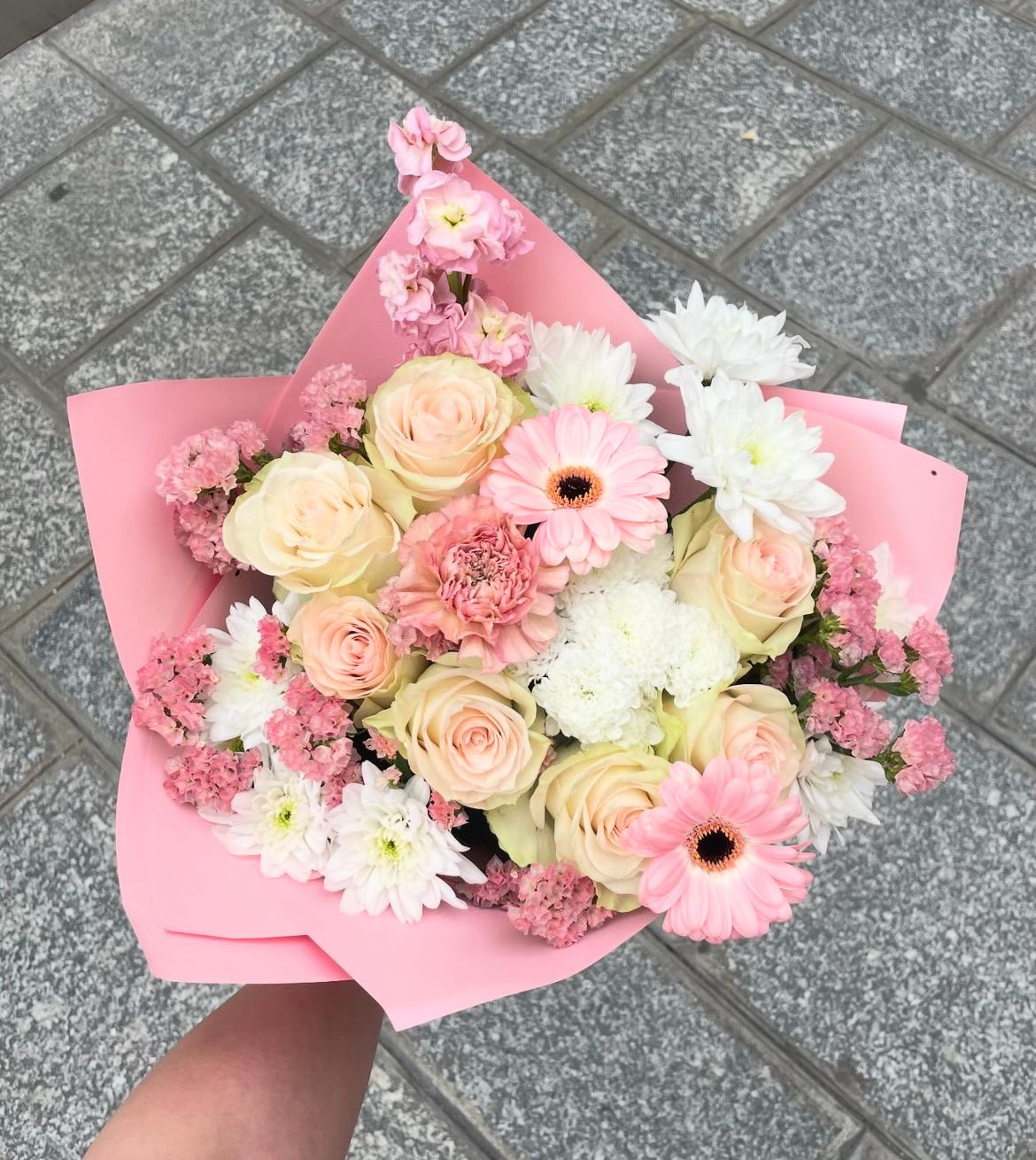 Blush pink mix of Flowers wrapped in a bouquet style