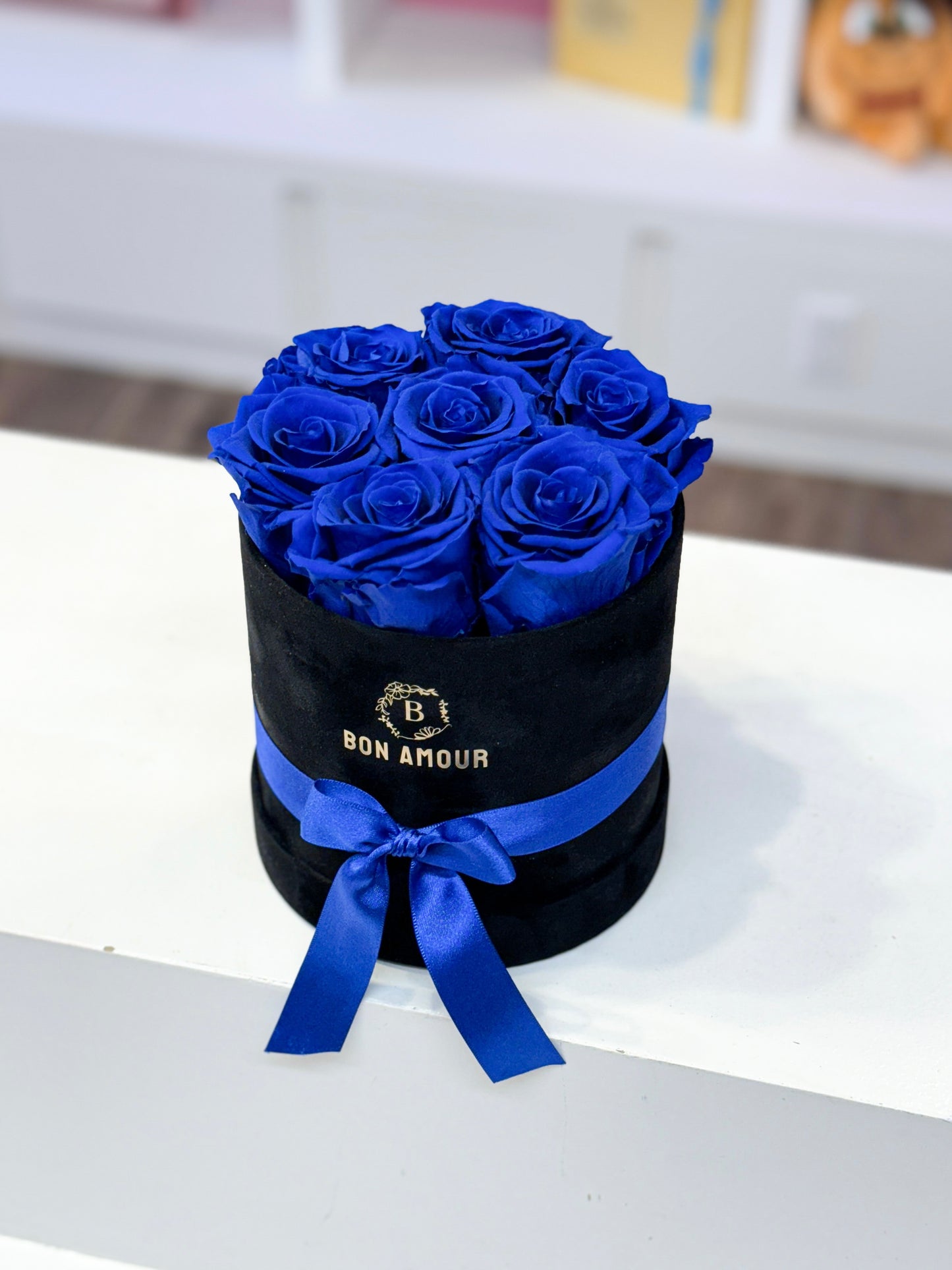 preserved blue roses in black velvet case