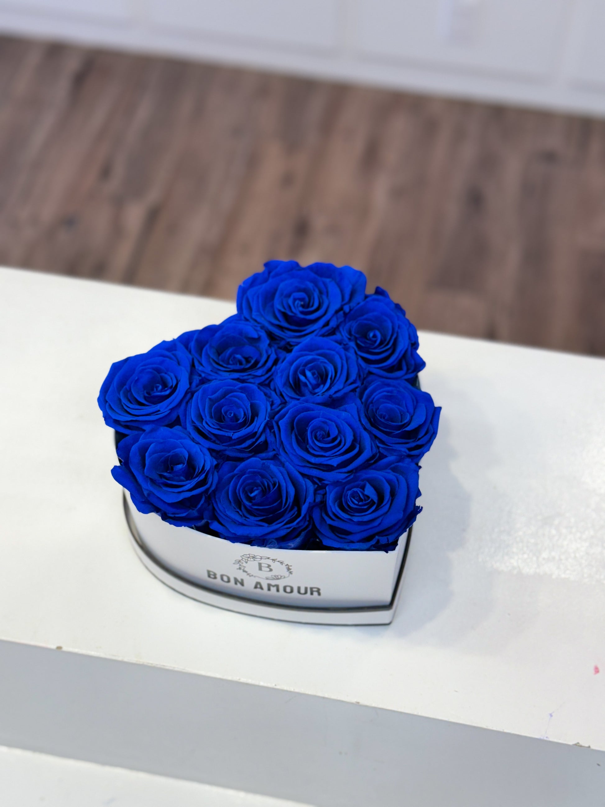 blue roses in a heart box